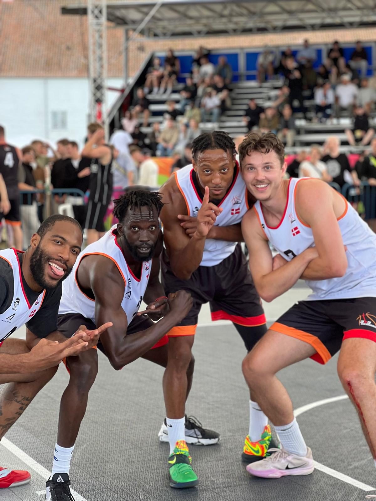 Coach Deng Awak with teammates at a 3x3 tournament