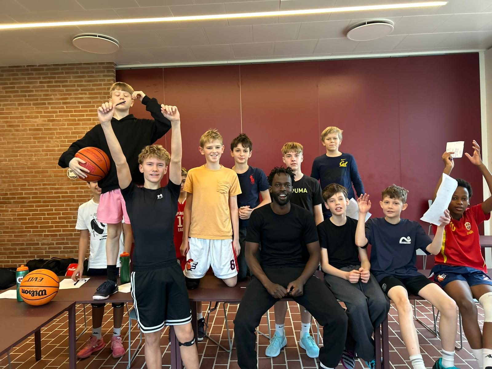 Coach Deng Awak with a Talata group indoors