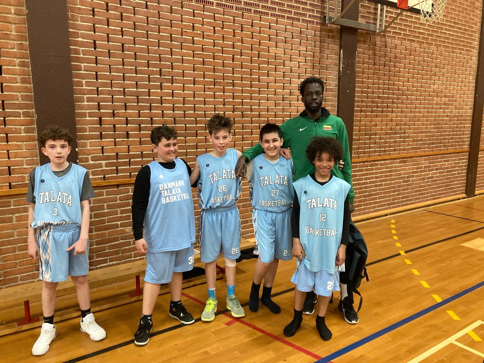 Talata Junior players in blue club jerseys