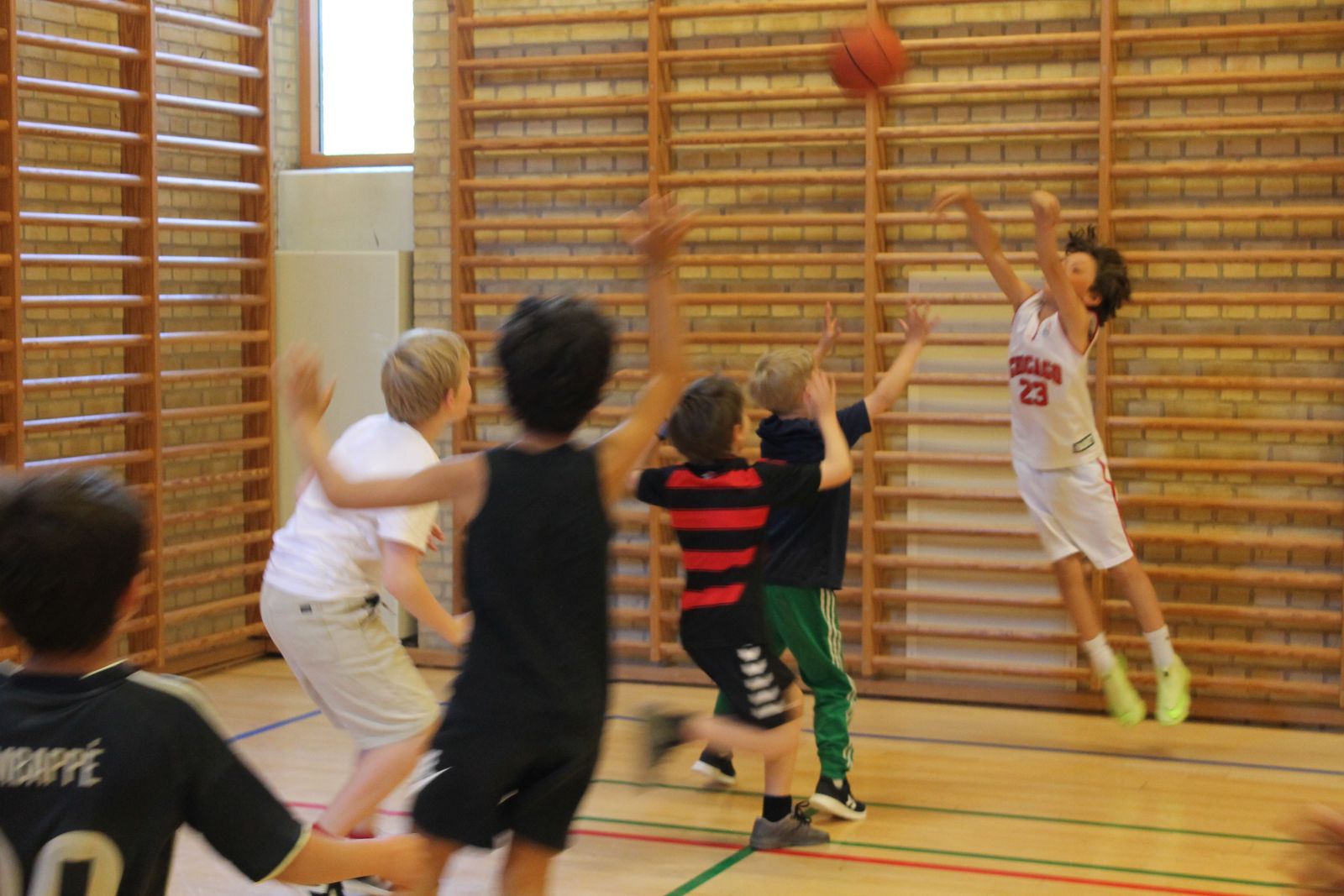 Kids contesting a shot during a Talata camp scrimmage