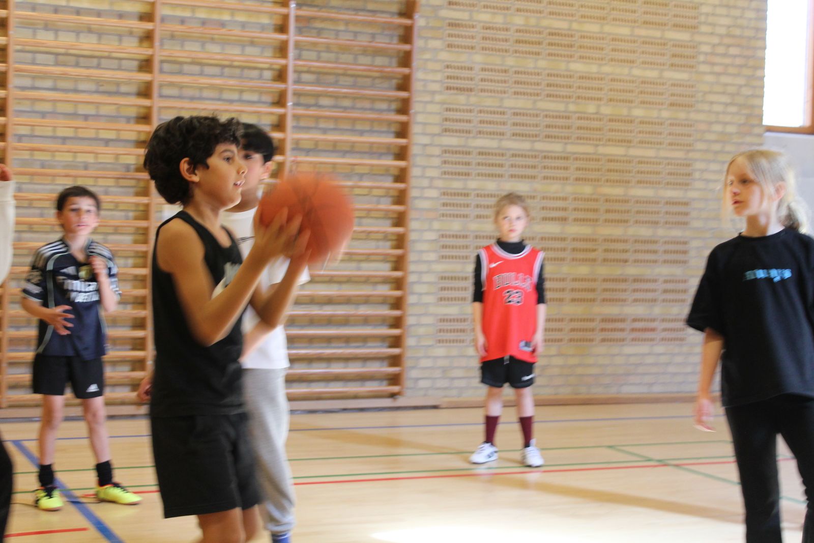 Young player squaring up with the ball during a camp drill