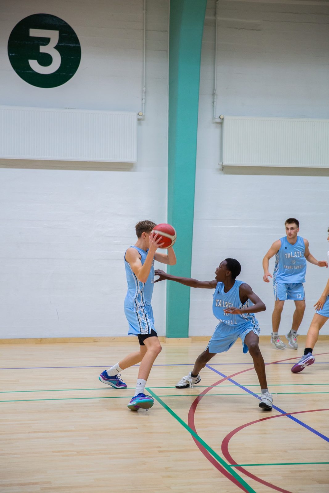 Talata Basketball player defending on the ball