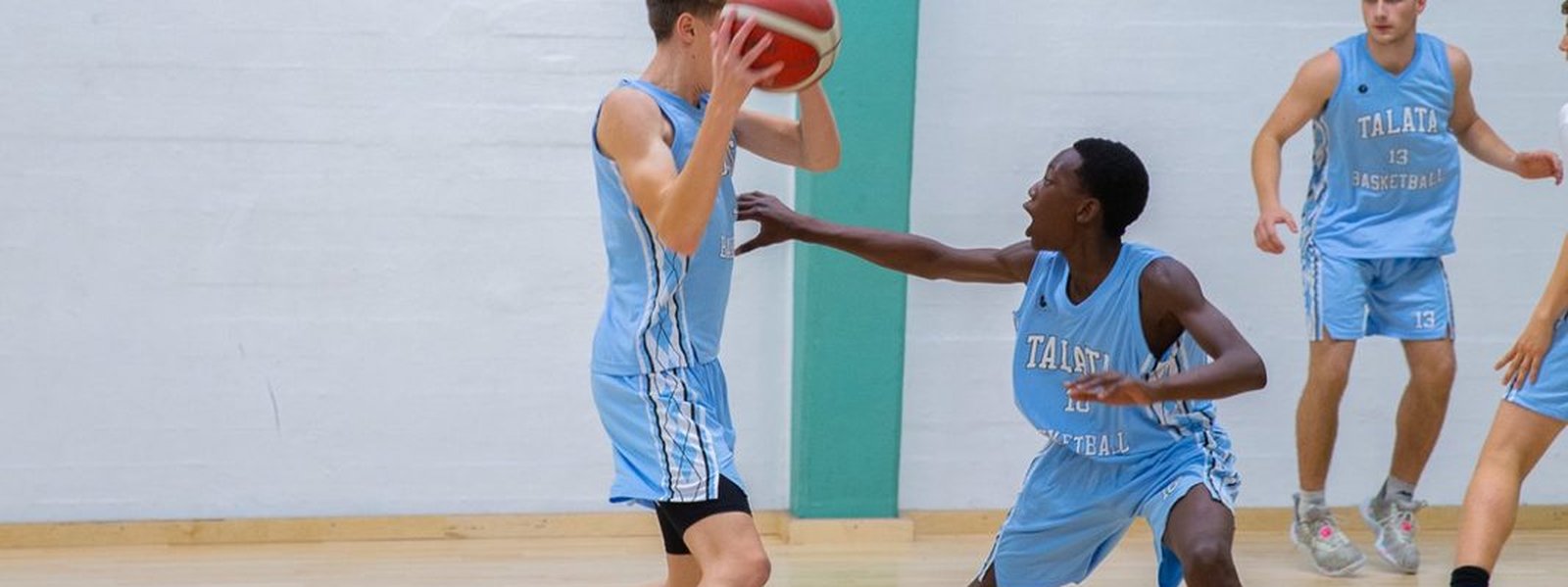 Talata Basketball player defending on the ball