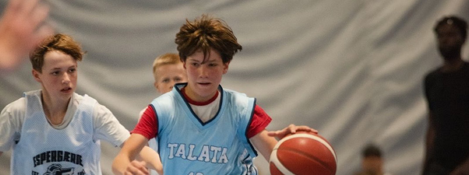 Talata Academy player driving to the basket