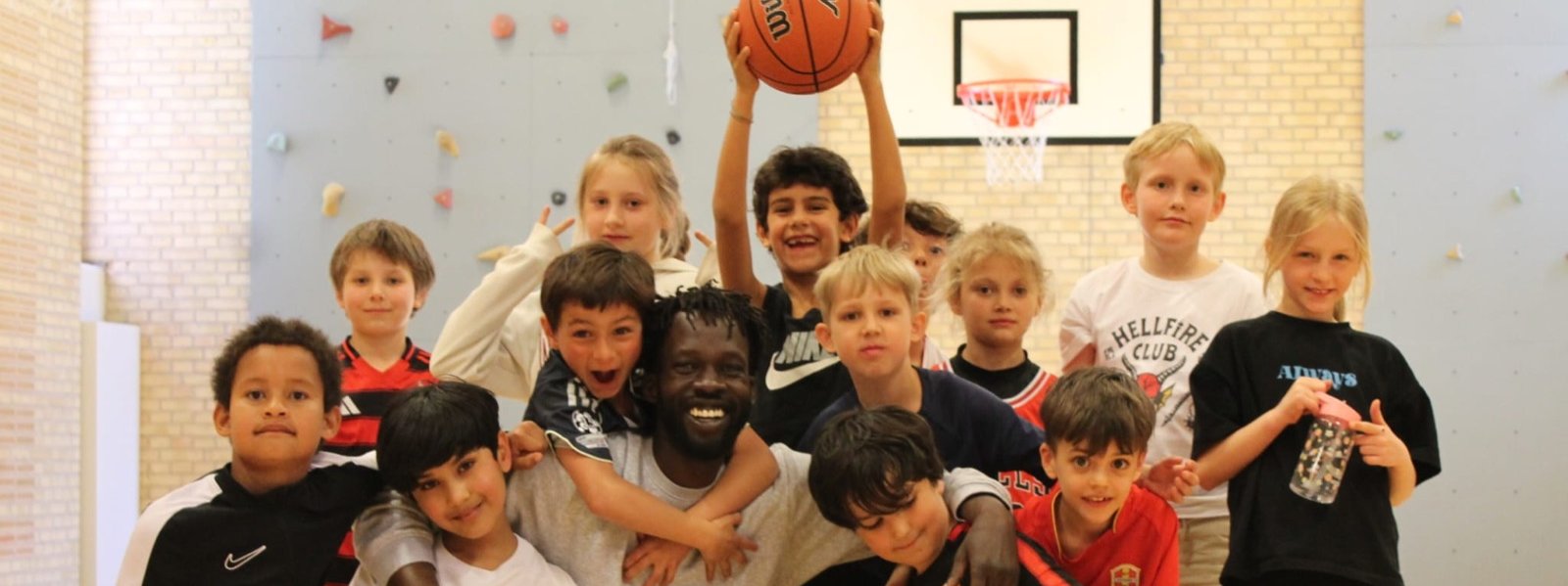 Young players smiling during a Talata Mini session in Copenhagen