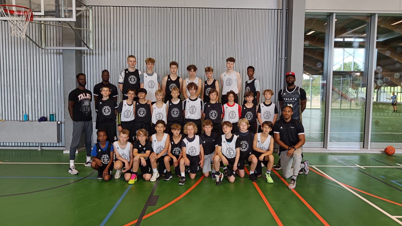 Talata Camp group photo, players and coaches in camp jerseys