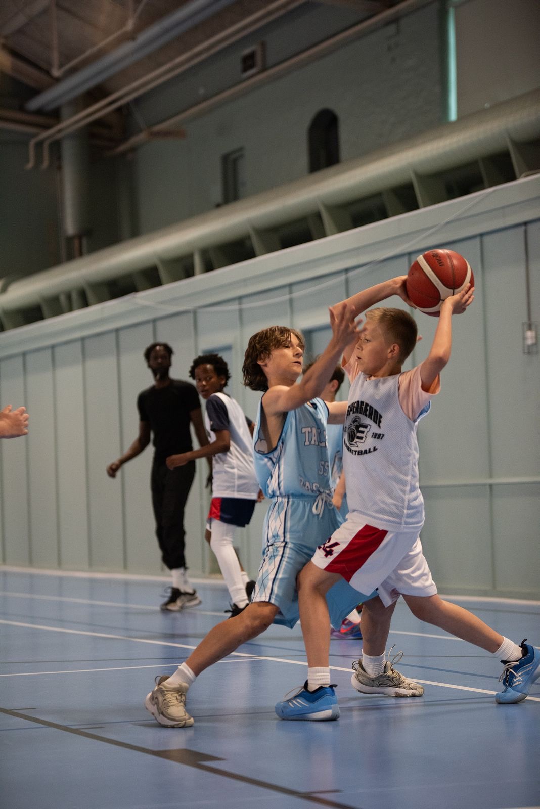Talata player shooting under defensive pressure