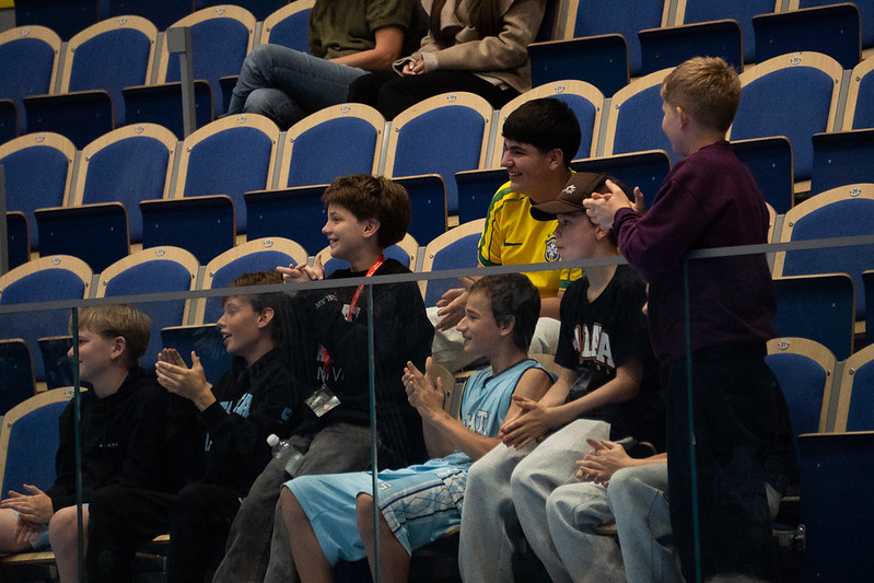 Talata players in club hoodies watching from the stands in Malm&ouml;
